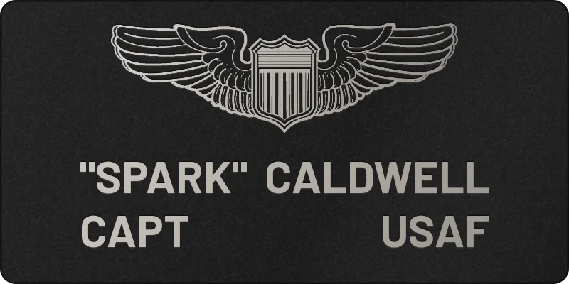 Custom 2x4 Air Force flight suit name tag with four-corner name and rank layout engraved in silver